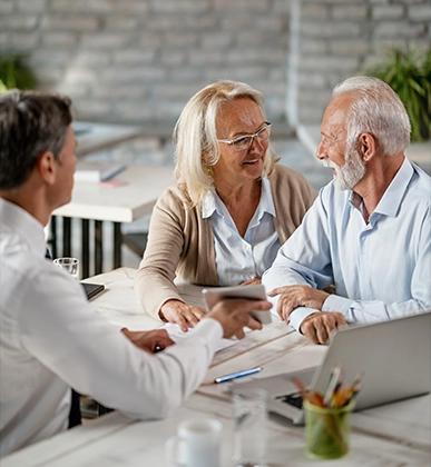 financial advisor meeting with clients to discuss annuities for retirement